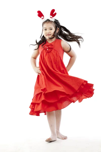 Портрет щасливої маленької дівчинки в сукні Санта — стокове фото