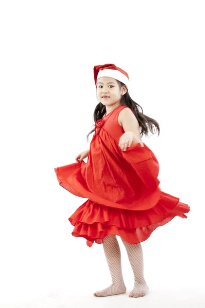 Портрет щасливої маленької дівчинки в сукні Санта — стокове фото