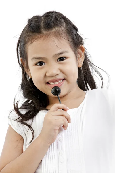 Hermosa niña con piruleta —  Fotos de Stock