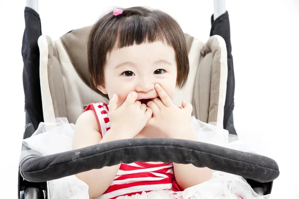 Baby in vergadering wandelwagen — Stockfoto