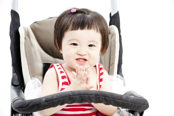 Baby in vergadering wandelwagen — Stockfoto