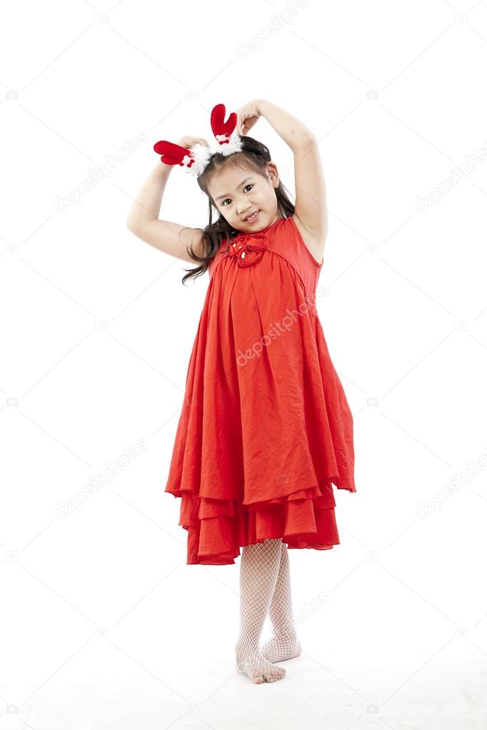 Portrait of happy little girl in Santa dress