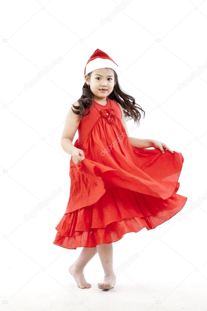Portrait of happy little girl in Santa dress