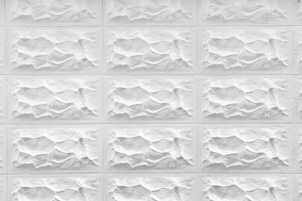 装饰白色石头墙表面的模式 — 图库照片