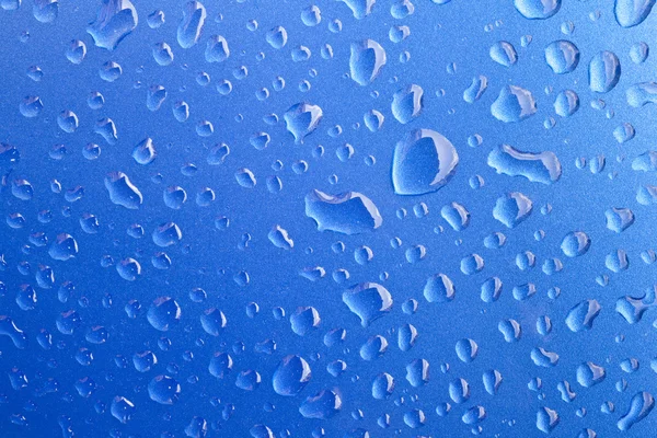 Primer plano de las gotas de agua en la superficie metálica como fondo . — Foto de Stock