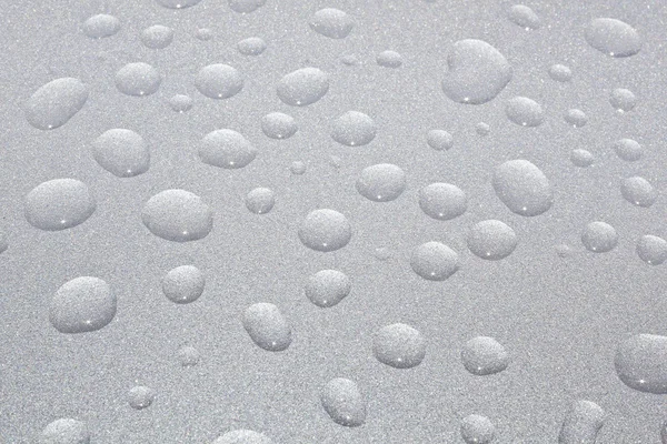 Close-up van water druppels op metalen oppervlak als achtergrond. — Stockfoto