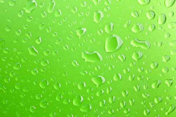 Primer plano de las gotas de agua en la superficie metálica como fondo. Verde — Foto de Stock