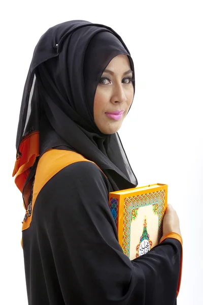 Muslim woman holding holy koran — Stock Photo, Image