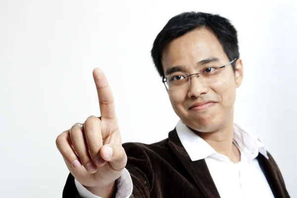 Young business man pointing to the screen — Stock Photo, Image