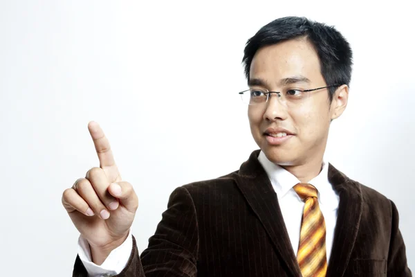 Young business man pointing to the screen — Stock Photo, Image