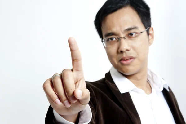 Young business man pointing to the screen — Stock Photo, Image