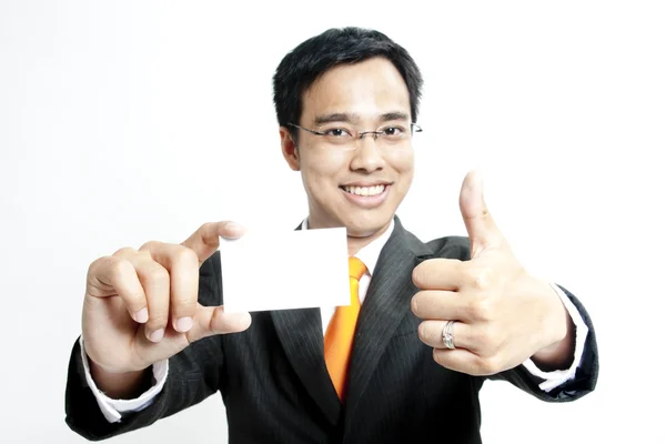 Business man holding blank note card — Stock Photo, Image