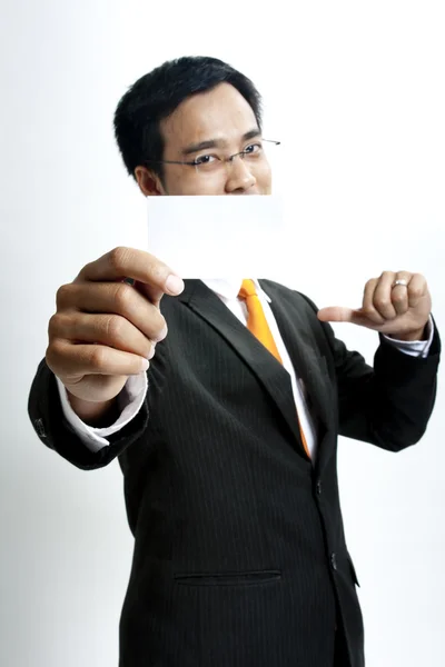 Affärsman som håller Tom Obs kort — Stockfoto