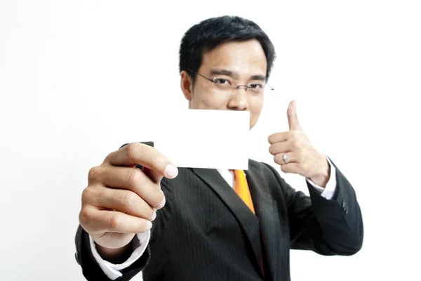 Obchodní muž drží prázdná Poznámka karta — Stock fotografie