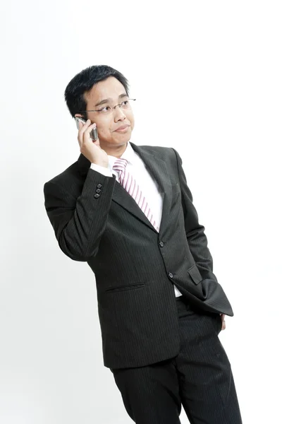 Businessman talking on cellphone — Stock Photo, Image