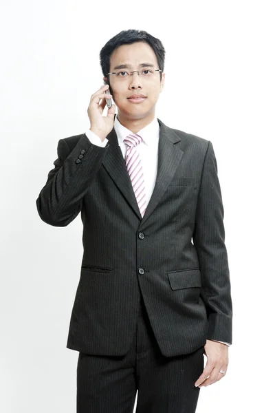 Businessman talking on cellphone — Stock Photo, Image