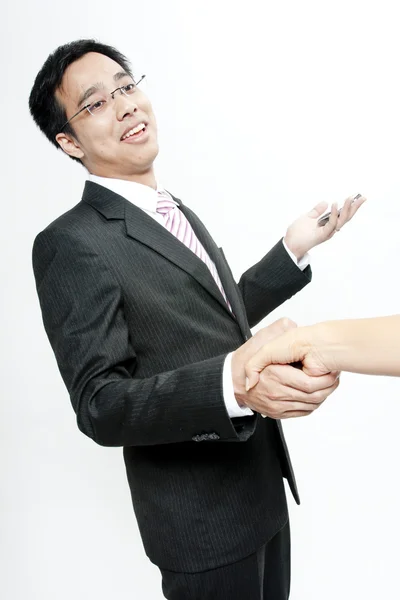 Vista del hombre de negocios extendiendo la mano para estrechar — Foto de Stock