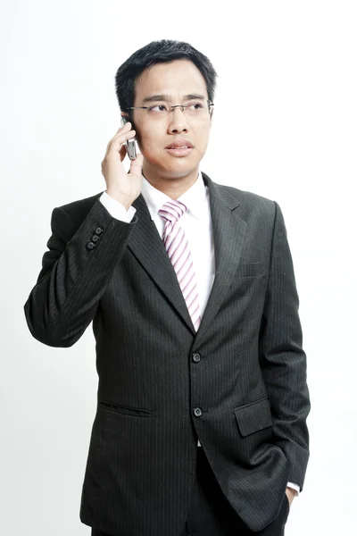 Businessman talking on cellphone — Stock Photo, Image