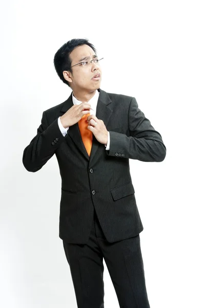 Portrait of a young business man pulling his collar — Stock Photo, Image