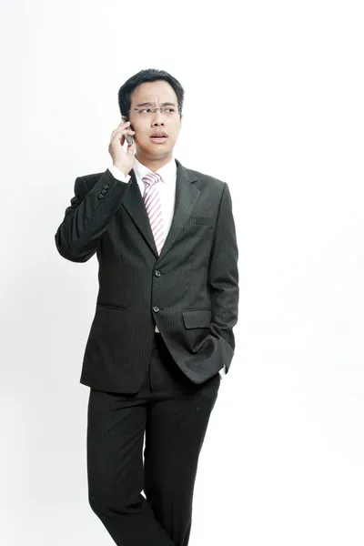 Businessman talking on cellphone — Stock Photo, Image