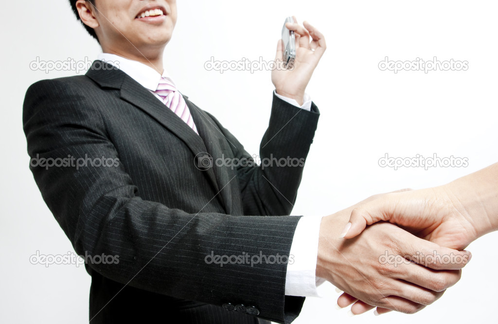 Closeup of two business men shaking hands on a deal