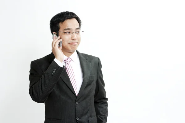 Businessman talking on cellphone — Stock Photo, Image