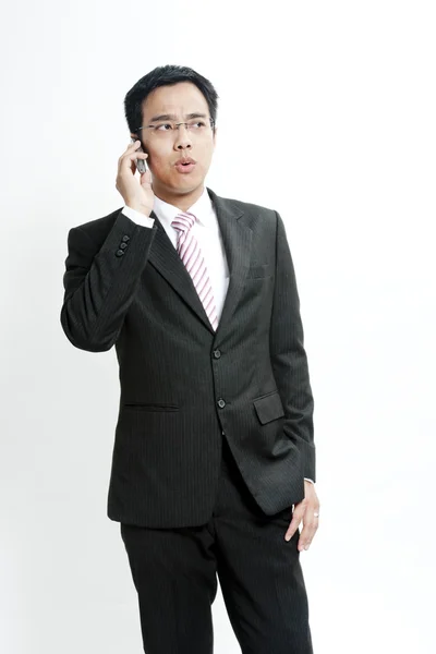 Businessman talking on cellphone — Stock Photo, Image