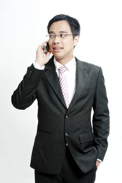 Businessman talking on cellphone — Stock Photo, Image