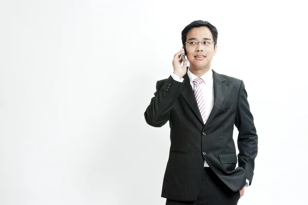 Businessman talking on cellphone — Stock Photo, Image