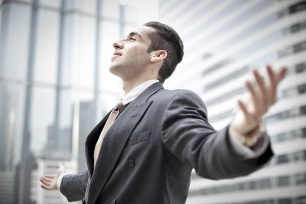 Happy young businessman and big city — Stock Photo, Image