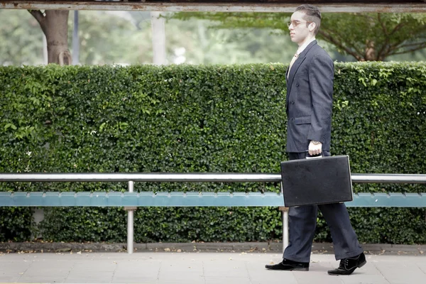 Businessman waiting for the bus — Stock Photo, Image