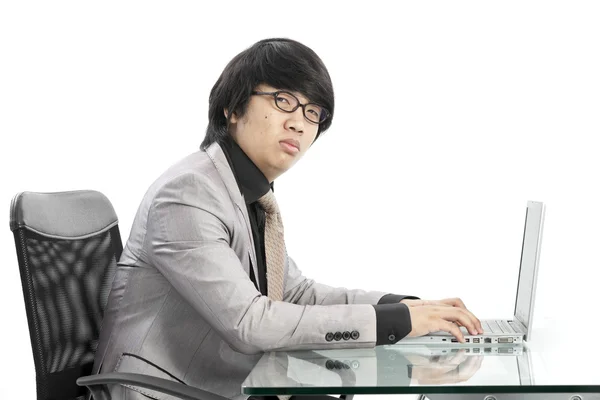 Young business man using new laptop and thinking — Stock Photo, Image