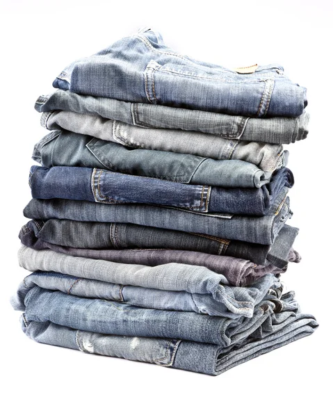 Lot of different blue jeans — Stock Photo, Image