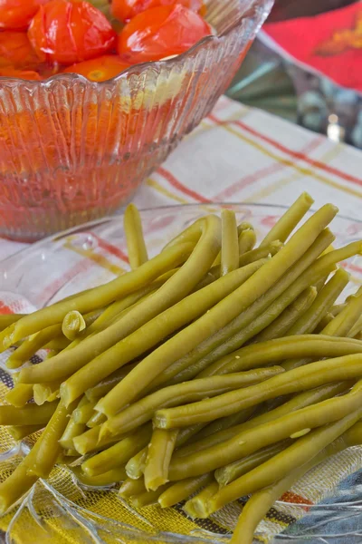 Canned tomatoes and green beans — Stock Photo, Image