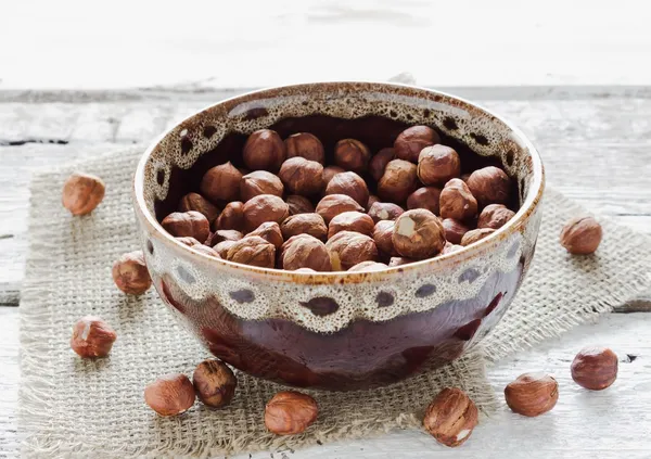 Hazelnuts in a ceramic dish — Stock Photo, Image