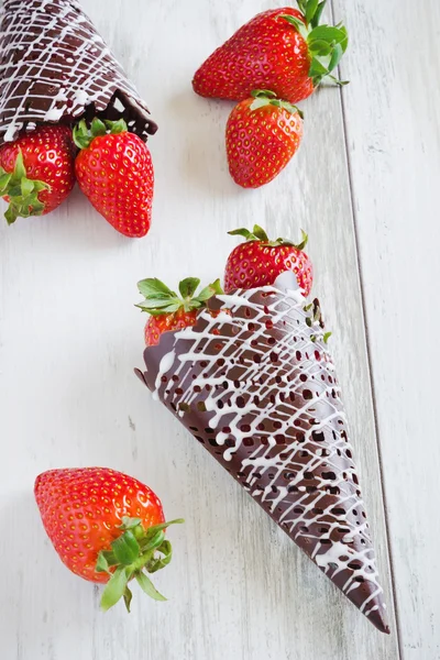 Strawberries in chocolate horns — Stock Photo, Image