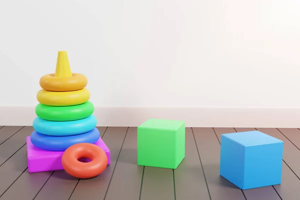床の子供のおもちゃ リングでピラミッドの混乱を閉じ ラミネートのカラフルなキューブとボール 白い壁にコピースペースがある子供の散乱おもちゃ 3Dレンダリング — ストック写真