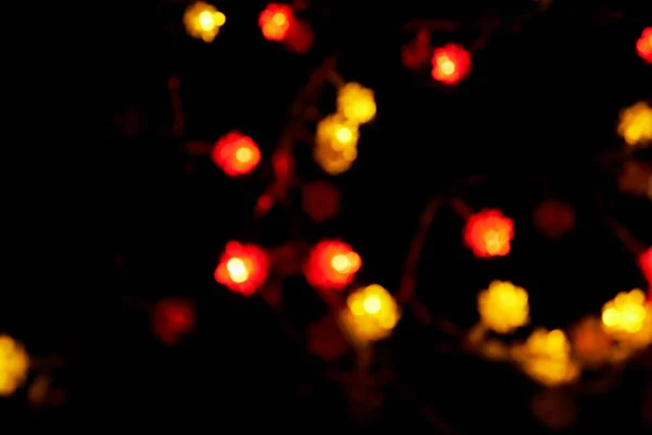 Defokussierte Bokeh Weihnachten Valentinstag Rot Orangefarbene Lichter Auf Schwarzem Hintergrund — Stockfoto