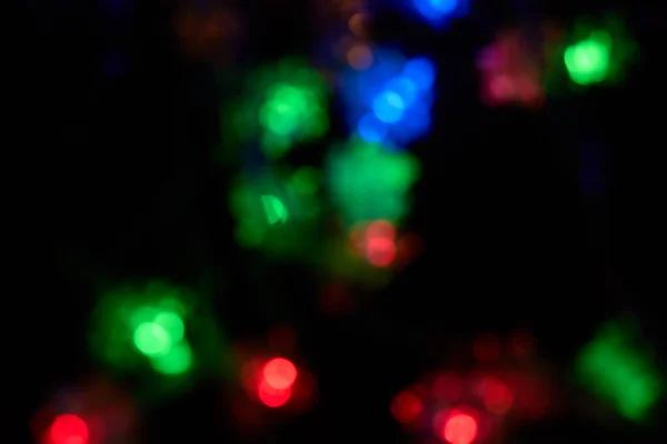 Desenfocado Bokeh Navidad Luces Multicolores Sobre Fondo Negro Textura Borrosa —  Fotos de Stock