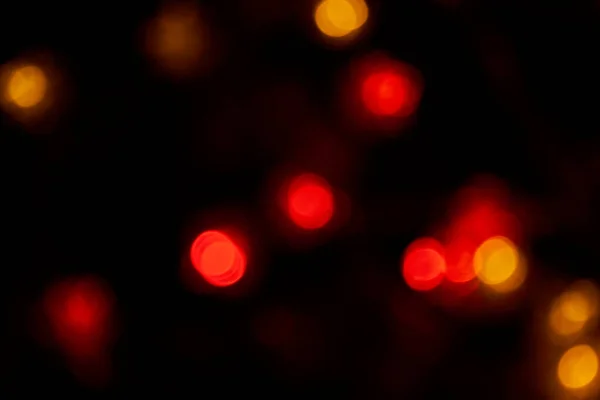 Defokussiert Bokeh Rote Große Lichter Auf Schwarzem Hintergrund Verschwommene Abstrakte — Stockfoto