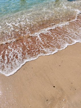 Sea coast as a background from top view. Travel and vacation image. Beach. Seascape. Small waves.