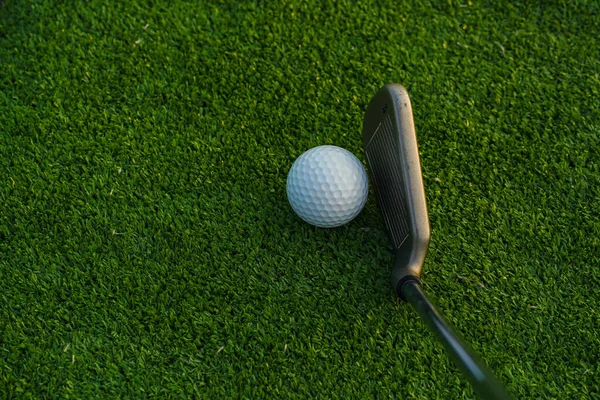 Golf balls on the golf course with golf clubs ready for golf in the first short. In the morning, with the beautiful sunlight.