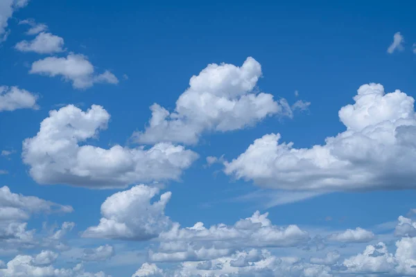 Blue sky with white clouds. Sky and clouds during the daytime in the summer. white fluffy clouds in the blue sky.