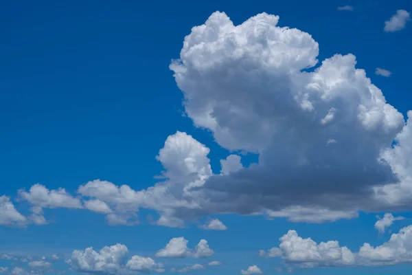 Blue sky with white clouds. Sky and clouds during the daytime in the summer. white fluffy clouds in the blue sky.