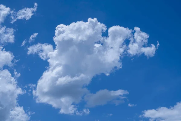 Blue sky with white clouds. Sky and clouds during the daytime in the summer. white fluffy clouds in the blue sky.