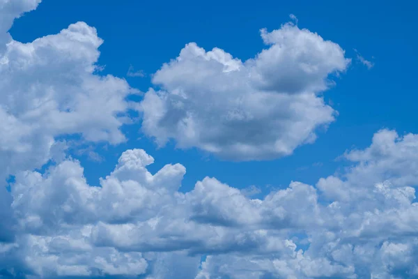 Blue sky with white clouds. Sky and clouds during the daytime in the summer. white fluffy clouds in the blue sky.