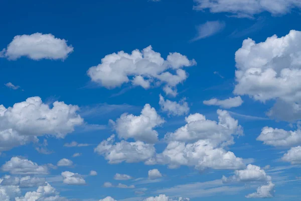 Blue sky with white clouds. Sky and clouds during the daytime in the summer. white fluffy clouds in the blue sky.