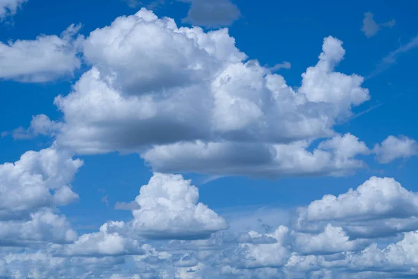 Blue sky with white clouds. Sky and clouds during the daytime in the summer. white fluffy clouds in the blue sky.