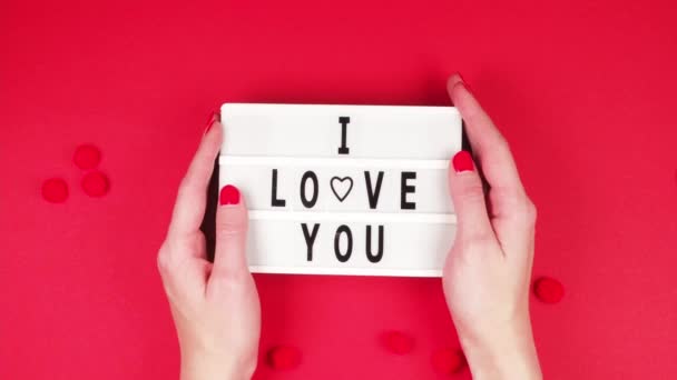 Hands Young Girl Hold White Board Inscription Love You Red — Stockvideo