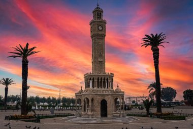 Izmir Clock Tower in Konak square. Famous place. Sunset colors clipart